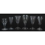 Six 18th century glasses with etched decoration including a pair, the largest 13.5cm high