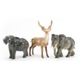 Collectable china animals comprising Beswick elephant, Beswick stag and Goebel elephant, the largest