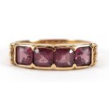 9ct gold garnet four stone ring, size T, 3.0g