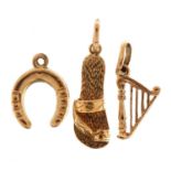 Three 9ct gold charms comprising horseshoe, sandal and harp, the largest 2.1cm high, 2.0g