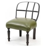 Industrial style wrought iron chair with green leather upholstered seat on turned mahogany legs,