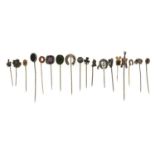Eighteen assorted Victorian and later hatpins including cricket, horse, scarab beetle, Queen