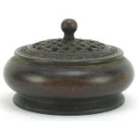 Chinese patinated bronze censer with pierced cover, 9.5cm in diameter
