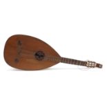 Antique wooden melon shaped lute with mother of pearl inlay, 94cm in length