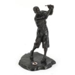 Patinated spelter study of a golfer enamelled with Red Cross star, indistinctly signed, 25cm high