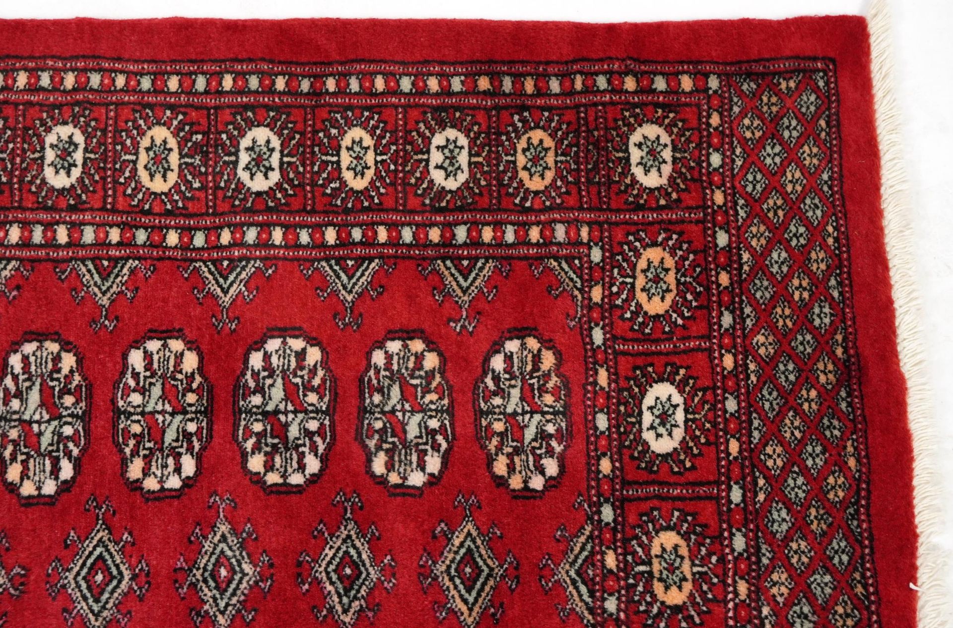 Rectangular Bokhara red ground rug having an all over geometric design, 154cm x 96cm - Image 3 of 6