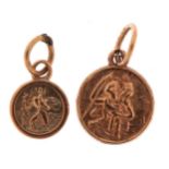 Two 9ct gold religious charms, the largest 1.2cm high, 1.3g