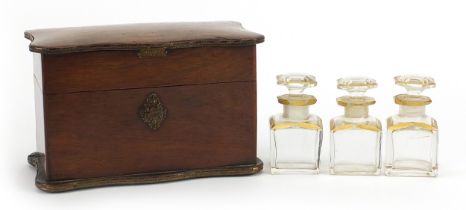19th century rosewood mechanical action box housing three cut glass scent bottles with Brevete S.