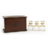 19th century rosewood mechanical action box housing three cut glass scent bottles with Brevete S.