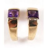 Pair of unmarked gold amethyst half hoop stud earrings, (tests as 9ct gold) 1.2cm high, 1.8g