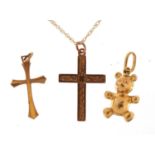 9ct gold jewellery comprising two cross pendants, teddy bear charm and necklace, the largest cross