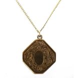 9ct gold locket with engraved decoration on a 14ct gold necklace, 2cm high and 40cm in length, the