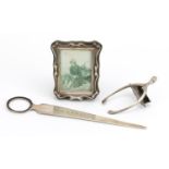 Silver objects comprising miniature easel photo frame, wishbone letter clip and letter opener