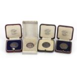 Four silver Insurance Athletic Association Championship medals, two with enamel, each awarded to J E