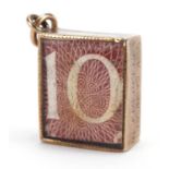 9ct gold emergency ten shilling note charm, 1.4cm wide, 2.4g