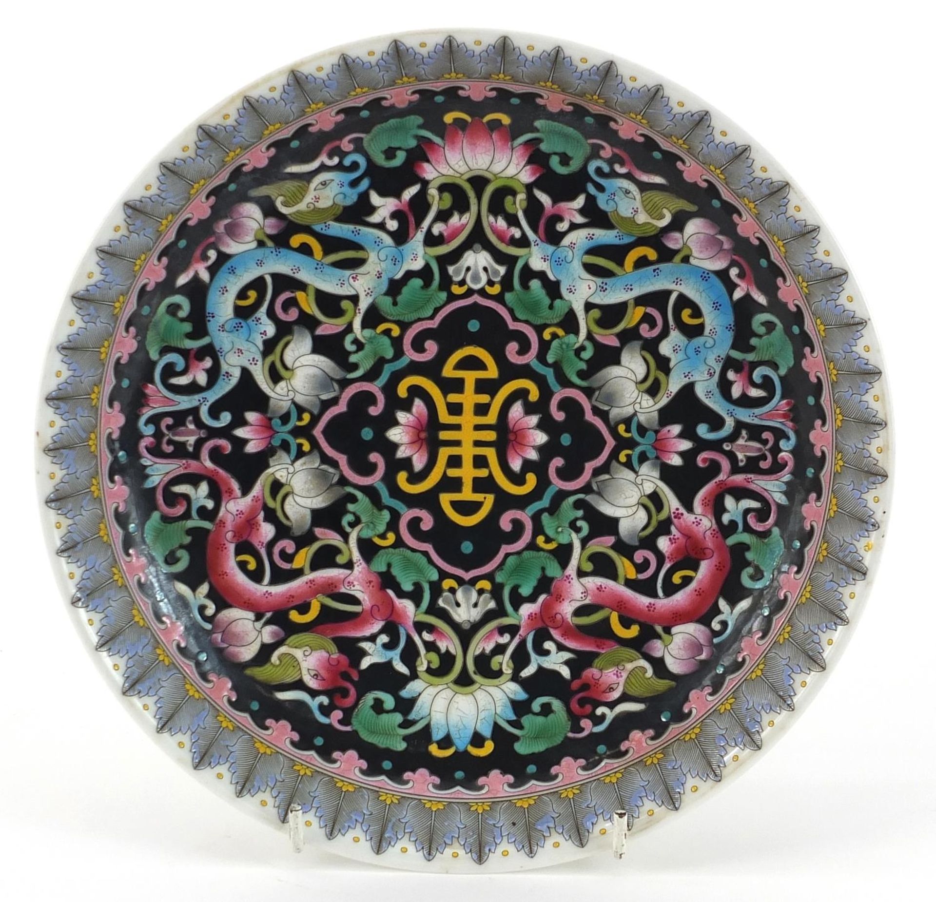 Chinese porcelain shallow dish hand painted in the famille noir palette with mythical animals