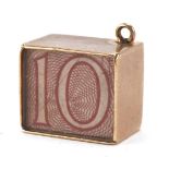 9ct gold emergency ten shilling note charm, 1.3cm high, 2.7g