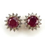 Pair of 9ct gold ruby and white sapphire stud earrings, 11mm in diameter, 2.8g