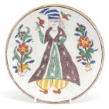 Turkish Kutahya pottery dish hand painted with a figure, 14.5cm in diameter