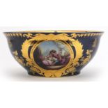 Italian blue glazed porcelain centre bowl gilded with flowers, decorated with a panel of lovers,