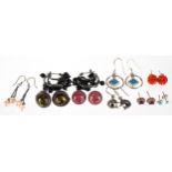 Nine pairs of silver earrings, some set with semi precious stones including cultured pearls, the