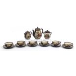 Japanese Satsuma pottery six place tea service hand painted with seated females, the teapot 17cm