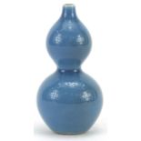 Chinese porcelain double gourd vase having a blue glaze, character marks to the base, 11cm high