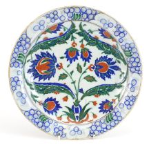 Turkish Iznik pottery shallow dish hand painted with flowers and leaves, 30cm in diameter