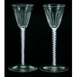 Pair of antique wine glasses with opaque twist stems and facetted bowls, each 14.5cm high