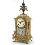 French style gilt metal mantle clock with circular dial having Roman and Arabic numerals and panel