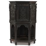 Antique gothic style carved oak hall cupboard mounted with classical figures, 139cm H x 90cm W x