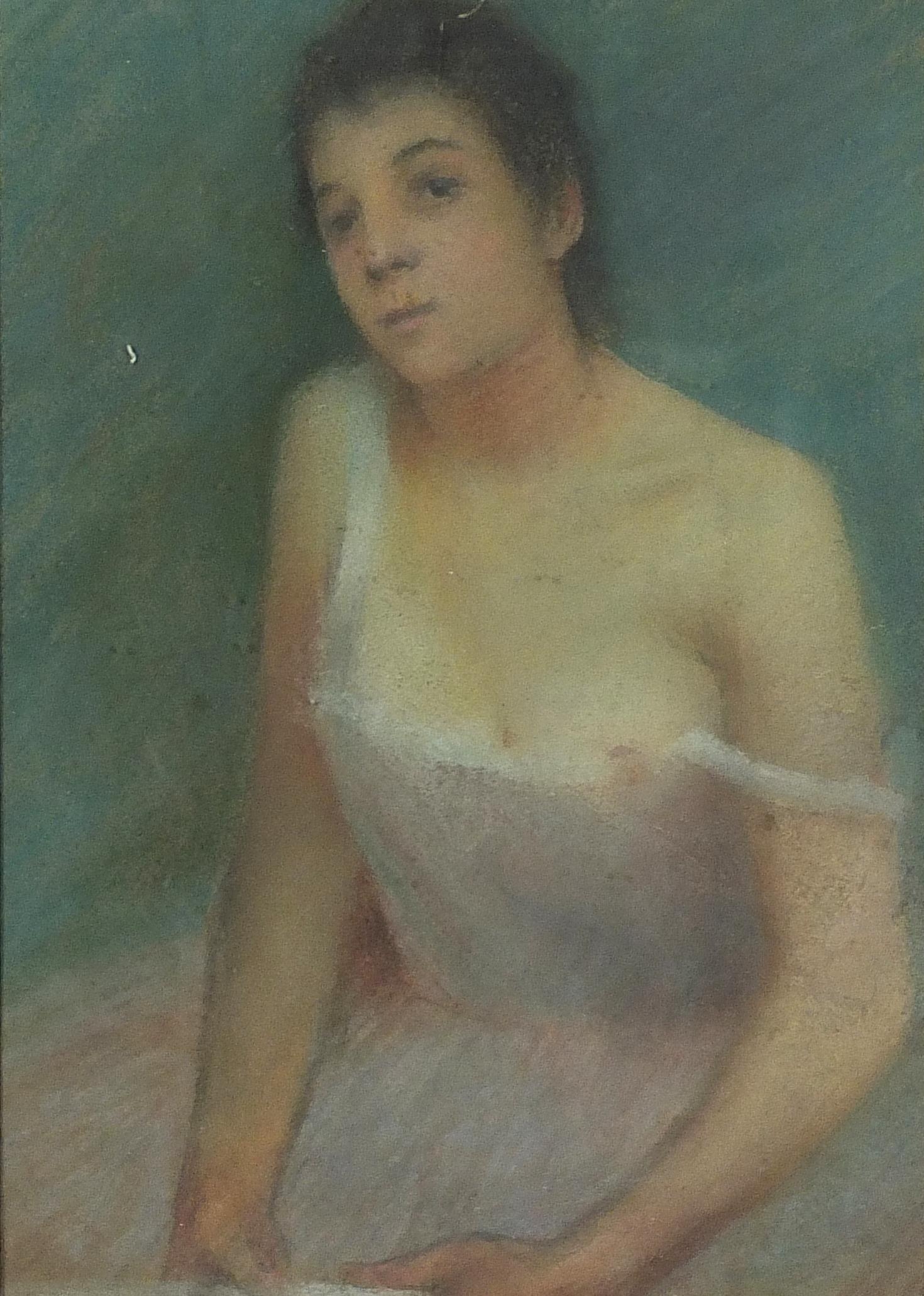 Top half portrait of a semi nude female, early 20th century French school pastel, label verso,