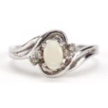 10ct white gold opal and diamond crossover ring, size N/O, 1.8g