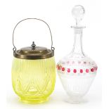 19th century ruby flashed glass decanter and a uranium glass biscuit barrel, the largest 31.5cm high