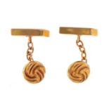 Pair of 9ct gold knot design cufflinks housed in a Dawson & Briant tooled leather box, 1.8cm wide,