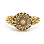 18ct gold diamond and pearl flower head ring with scrolled shoulders, size M, 3.1g