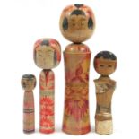 Four Japanese Kokeshi dolls, the largest 40cm high