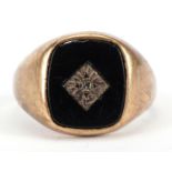 9ct gold black onyx signet ring set with a diamond, size Q, 4.1g