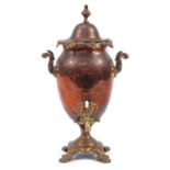 19th century copper samovar with brass tap and ceramic handles, the lid marked Warranted Best