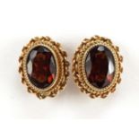 Pair of 9ct gold garnet stud earrings, 1.0cm high, 2.1g