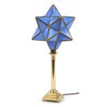 Brass candlestick design table lamp with star shade, 54.5cm high
