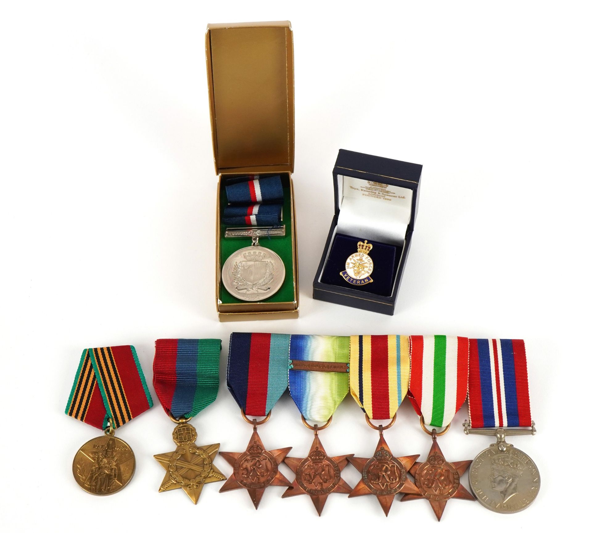 British military World War II medal group including four stars and an armed forces veteran badge