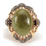 9ct gold cabochon green stone, diamond and sapphire ring with pierced setting, size N, 6.3g
