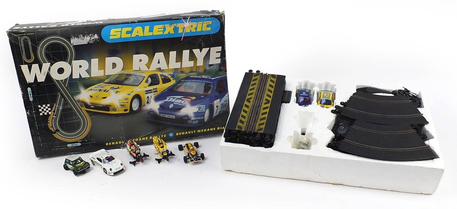 Scalextric World Rallye racing set with box together with three other Scalextric cars and two