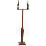 Carved oak and champagne bottle standard lamp, 190cm high