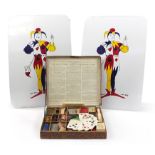 The Ernest Sewell Cabinet of Conjuring Tricks with two large Joker cards, 62cm high