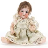 Heubach Koppelsdorf miniature bisque headed baby doll with open mouth and opening and closing