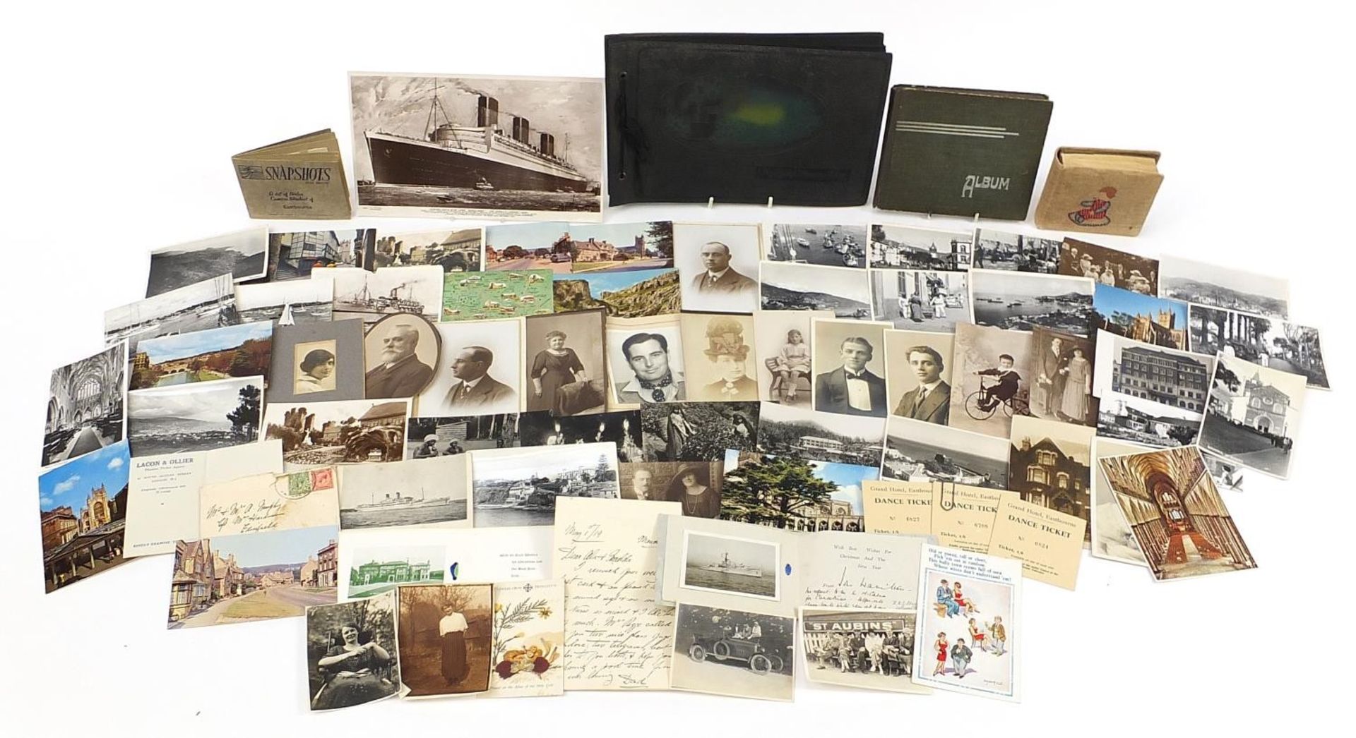 Collection of 19th century and later postcards and photographs, some arranged in albums, including