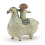 Scandinavian design pottery model of a boy on stylised horse, 14cm in length