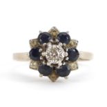 18ct white gold diamond and sapphire three tier flower head ring, size R, 4.4g